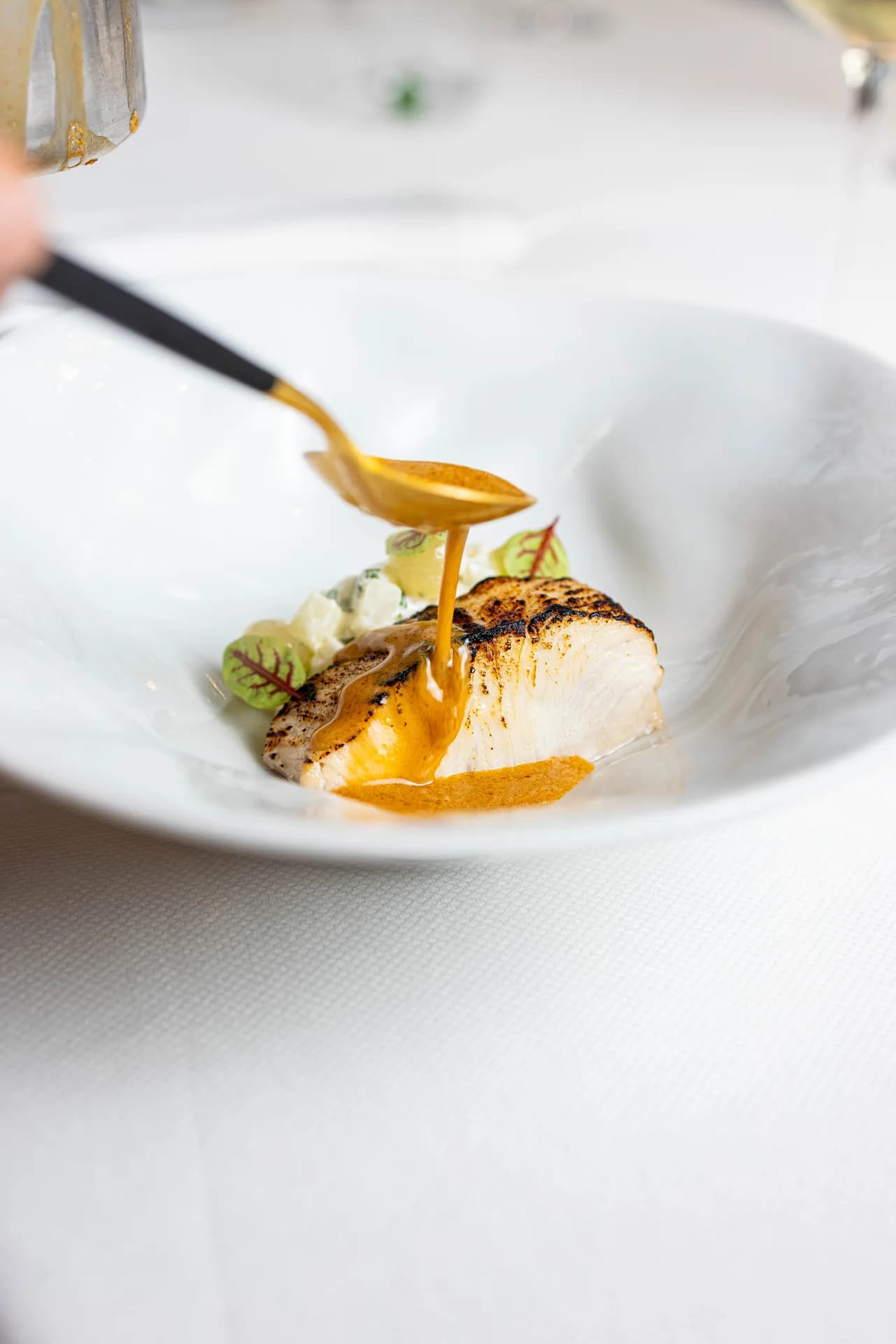 Uma fish course sauce pour.