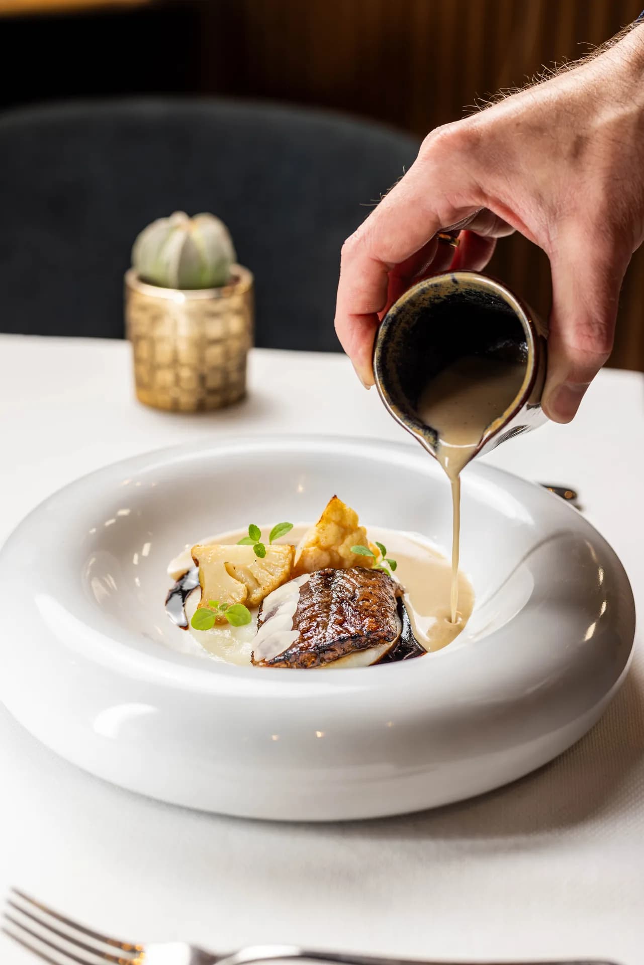 Uma sauce poured over fish.