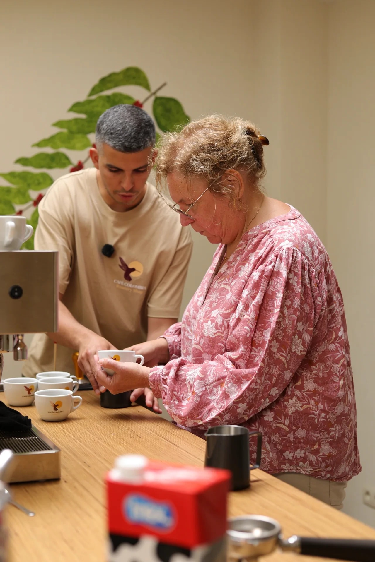 Content strategy workshop with two people reviewing material at a café table.