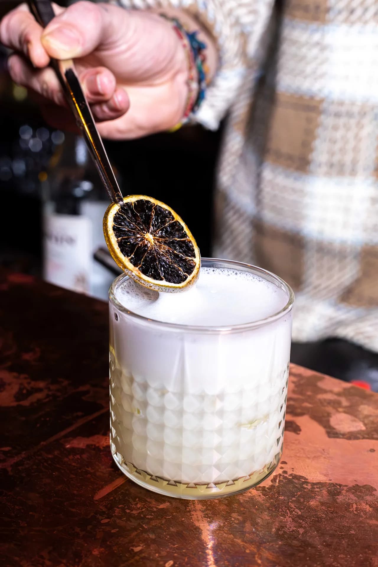 Smoked citrus cocktail being finished at Sushi Avenue.