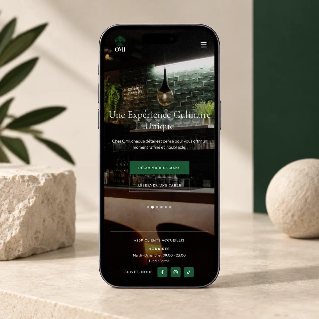 OMI restaurant website displayed on a mobile phone mockup.
